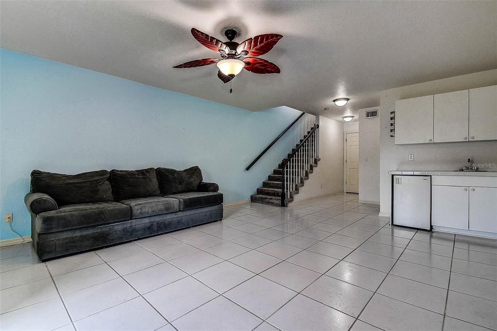 14865 Seminole Trail Seminole, FL 33776 - Photo 37 of 54 a living room with furniture and white cabinets