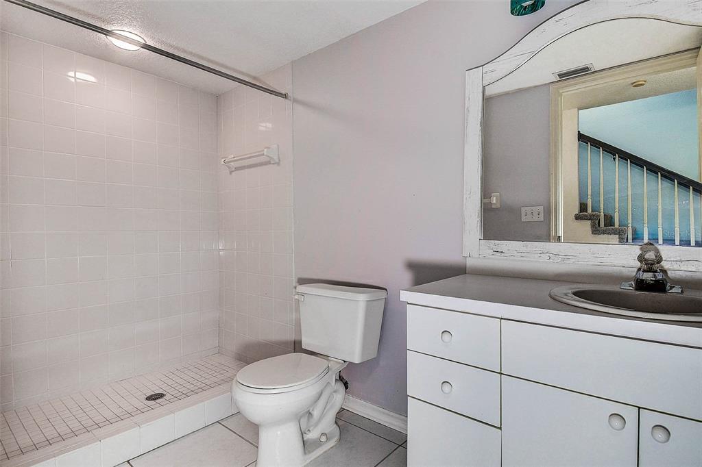 14865 Seminole Trail Seminole, FL 33776 - Photo 39 of 54 a bathroom with a sink a toilet and shower