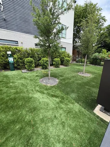a backyard of a house with lots of green space