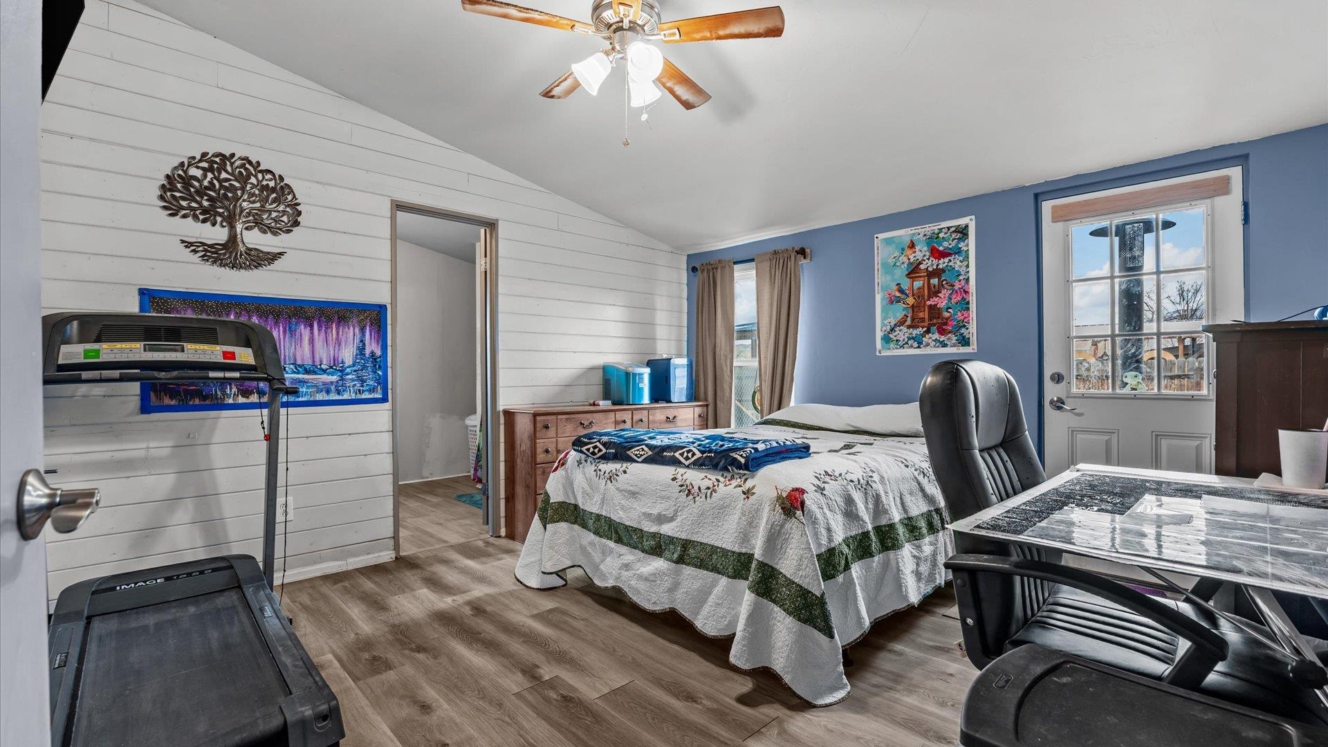 3216 E Road Clifton, CO 81520 - Photo 13 of 33 a bedroom with a bed and dresser with chair