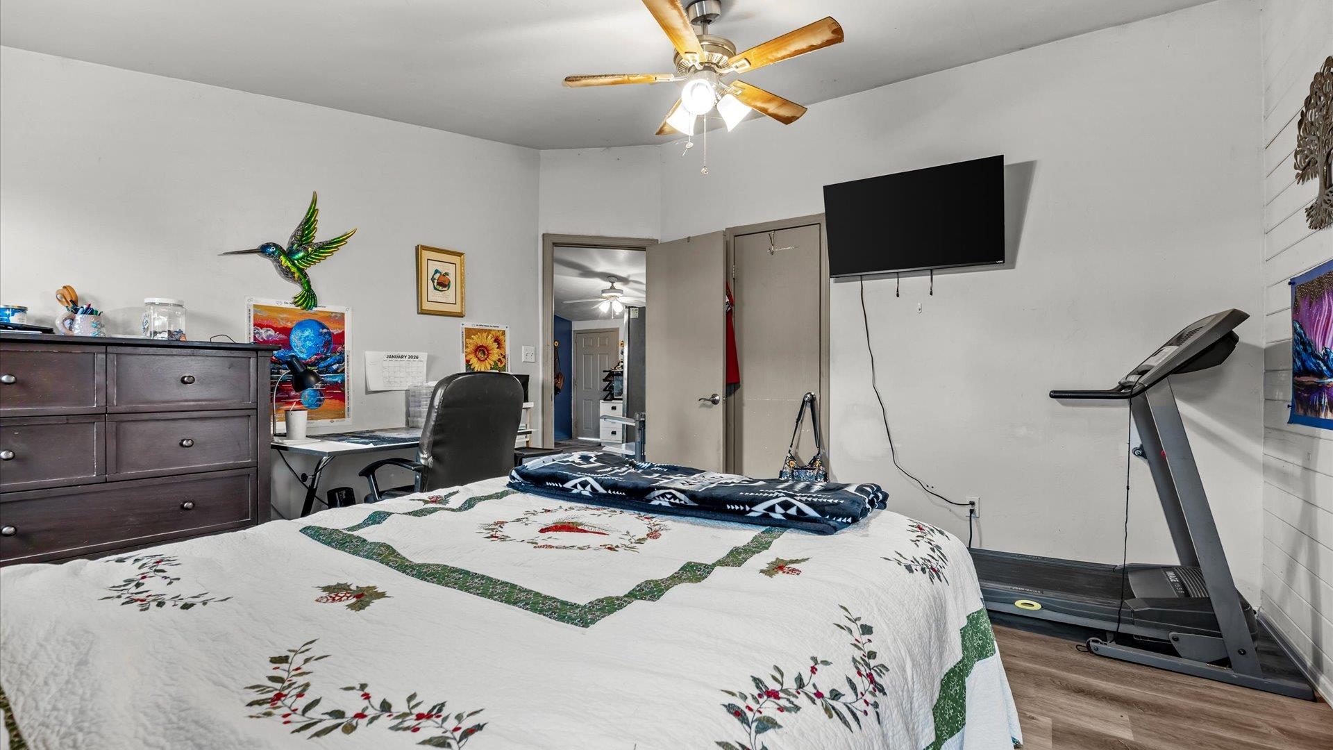 3216 E Road Clifton, CO 81520 - Photo 14 of 33 a bed room with a bed a television and dresser