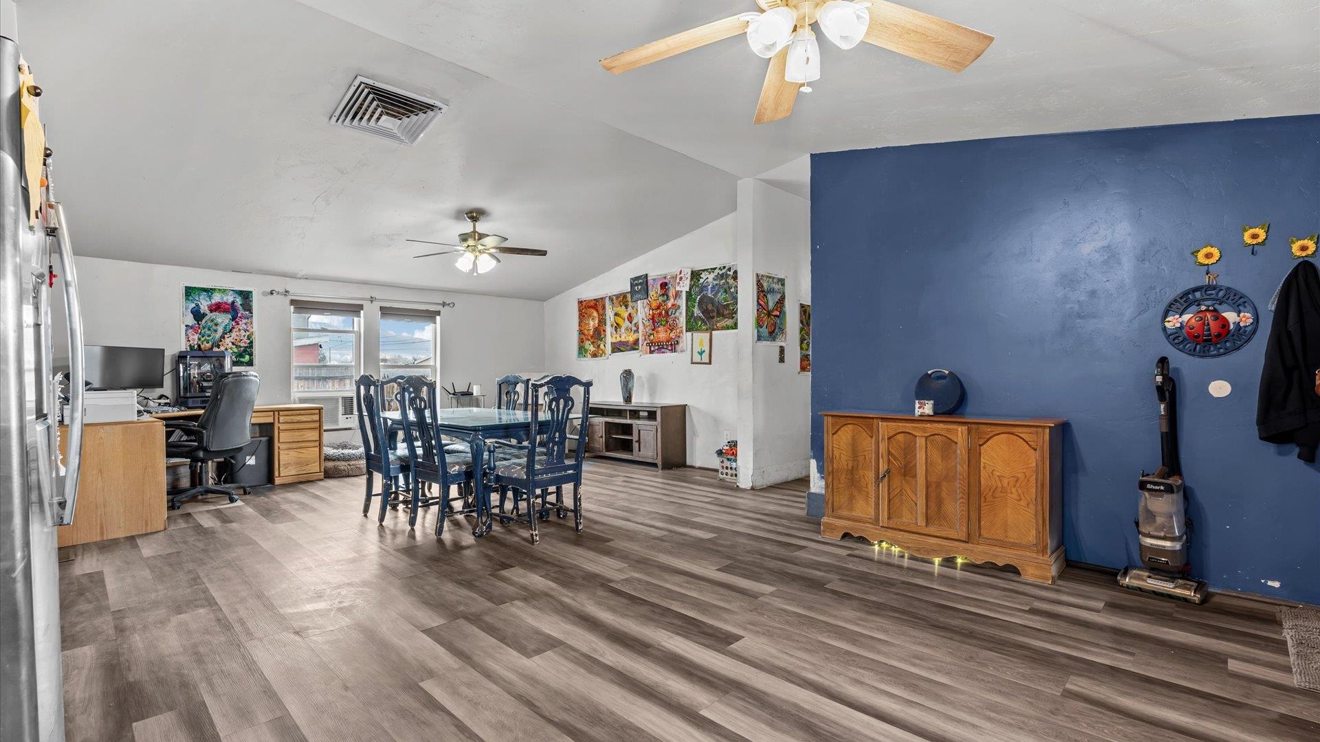 3216 E Road Clifton, CO 81520 - Photo 7 of 33 a view of a dining room with furniture and wooden floor
