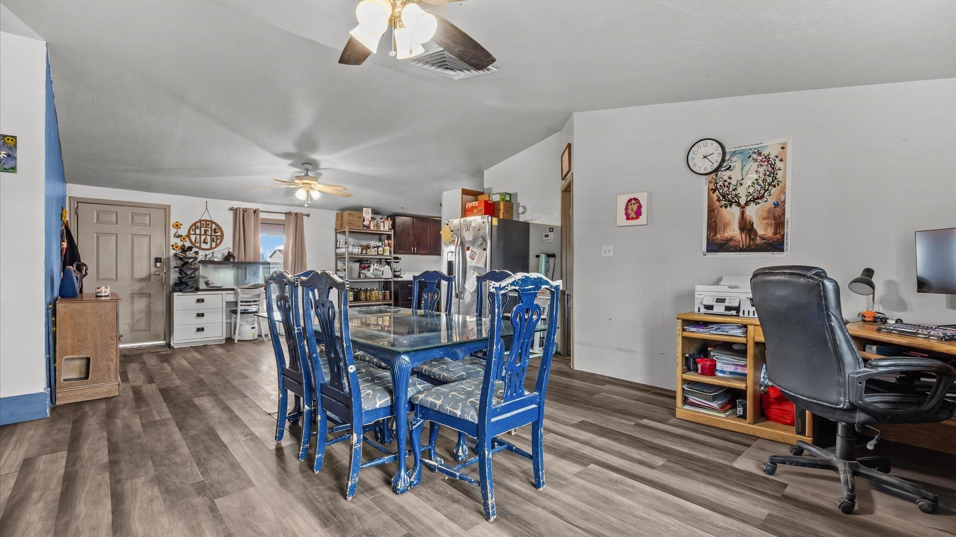 3216 E Road Clifton, CO 81520 - Photo 8 of 33 a dining room with furniture and wooden floor