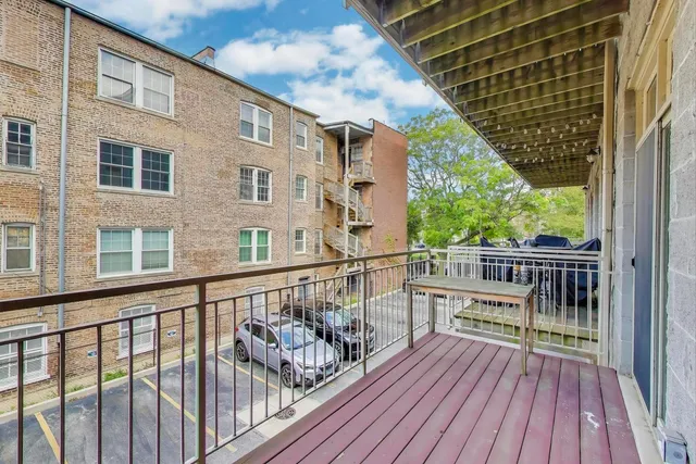a kitchen with stainless steel appliances granite countertop a refrigerator and microwave