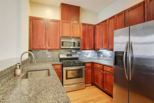 a view of a balcony with wooden floor