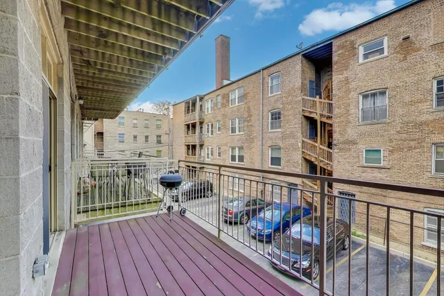 a bedroom with a bed and a mirror