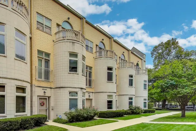 a large white building with a white roof