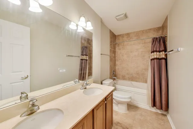 a view of a dining room with furniture and a window