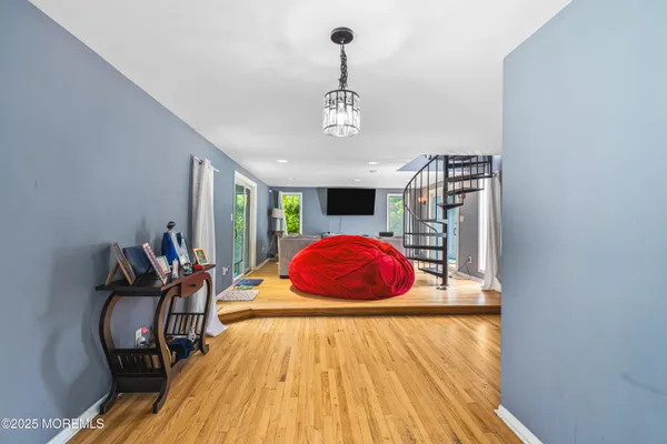 a view of a livingroom with wooden floor