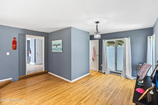 a bedroom with bed and window