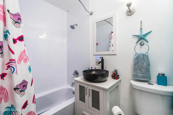 a bathroom with a sink a bath tub and a shower