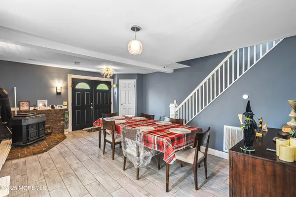a dining room with furniture and entryway