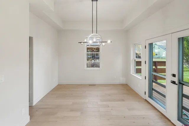 a view of a room with window hardwood floor and hallway