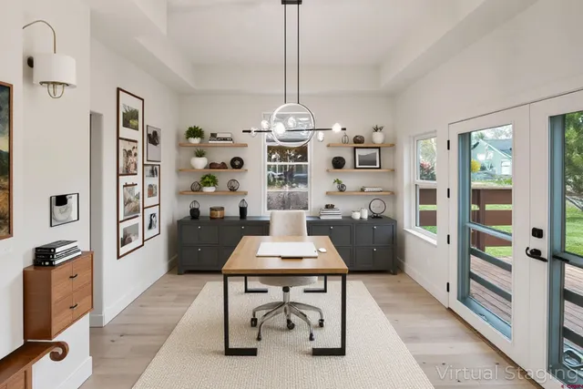 a living room with furniture a chandelier a rug and a flat screen tv