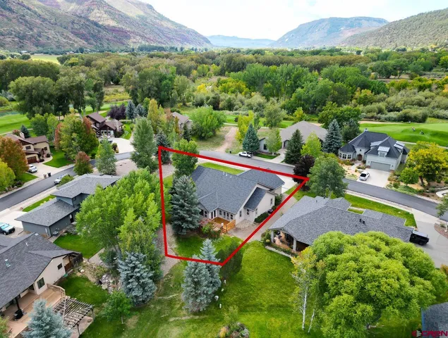 an aerial view of a house with a garden