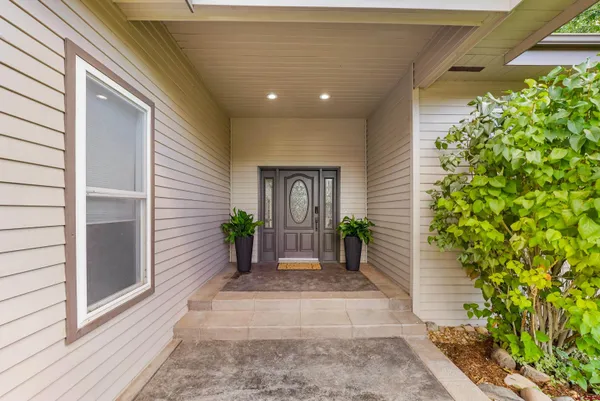 a kitchen with kitchen island a sink stainless steel appliances and cabinets