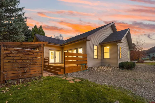 a backyard of a house with barbeque oven
