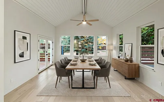 a view of a dining room with furniture and window