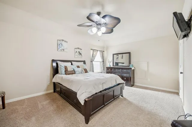 a bed room with a bed and a chandelier