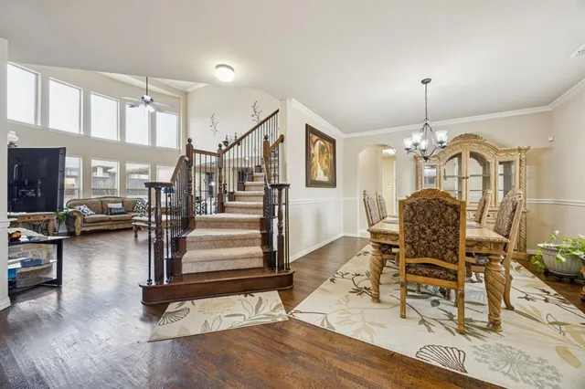 a view of a livingroom with furniture and a floor to ceiling window