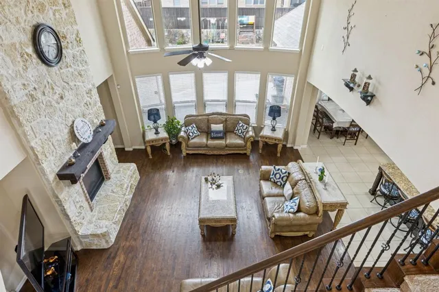 a view of living room with furniture and wooden floor