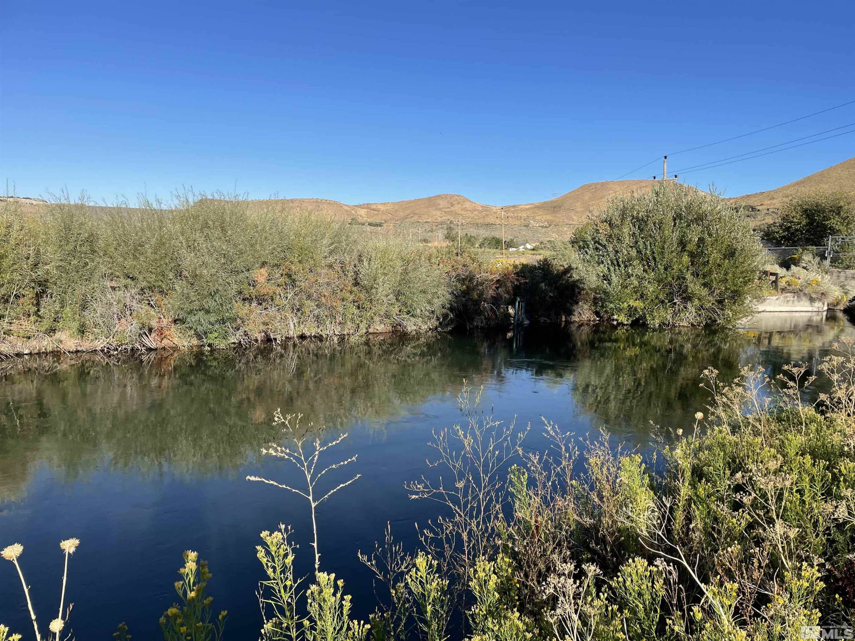 0 Mario Road Reno, NV 89523 - Photo 5 of 29 a view of a lake with a mountain in the background