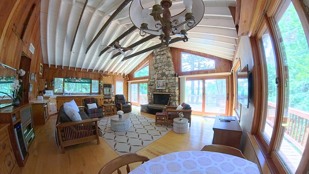 32 Pond Hill Road Goshen, MA 01096 - Photo 7 of 24 a living room with furniture fireplace and a large window