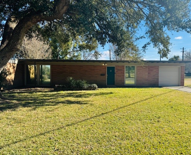 3500 Doris Street Bay City, TX 77414 - Photo 1 of 22 a front view of a house with a swimming pool
