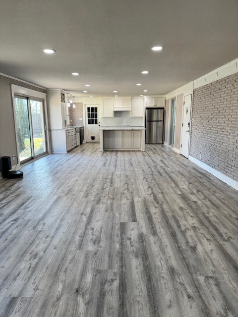 3500 Doris Street Bay City, TX 77414 - Photo 13 of 22 a view of empty room with wooden floor and windows