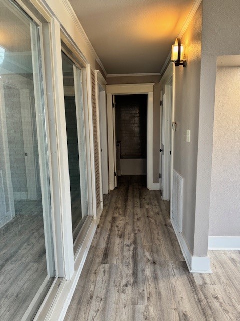 3500 Doris Street Bay City, TX 77414 - Photo 15 of 22 a view of a hallway with wooden floor and staircase