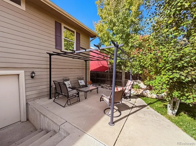 a view of a chairs and tables in the patio