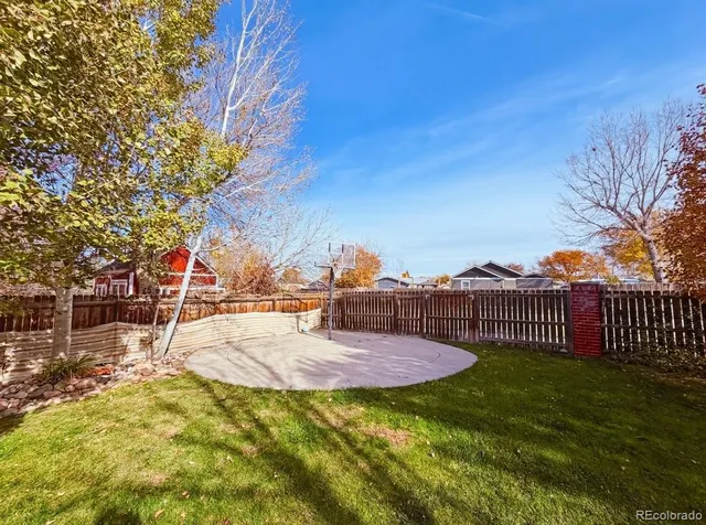 a view of a patio with a table and chairs