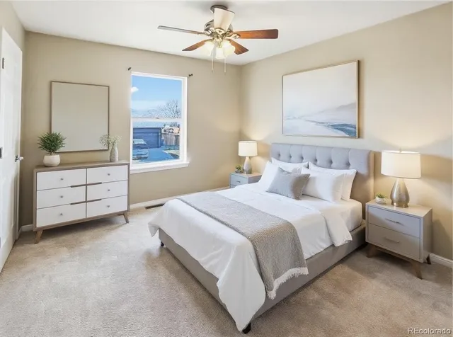 a bedroom with bed and window