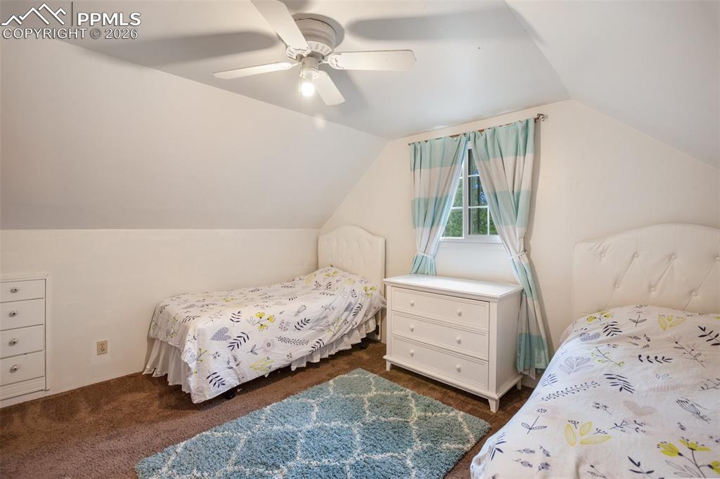 377 Ridge Road Divide, CO 80814 - Photo 37 of 50 a bedroom with a bed and a dresser