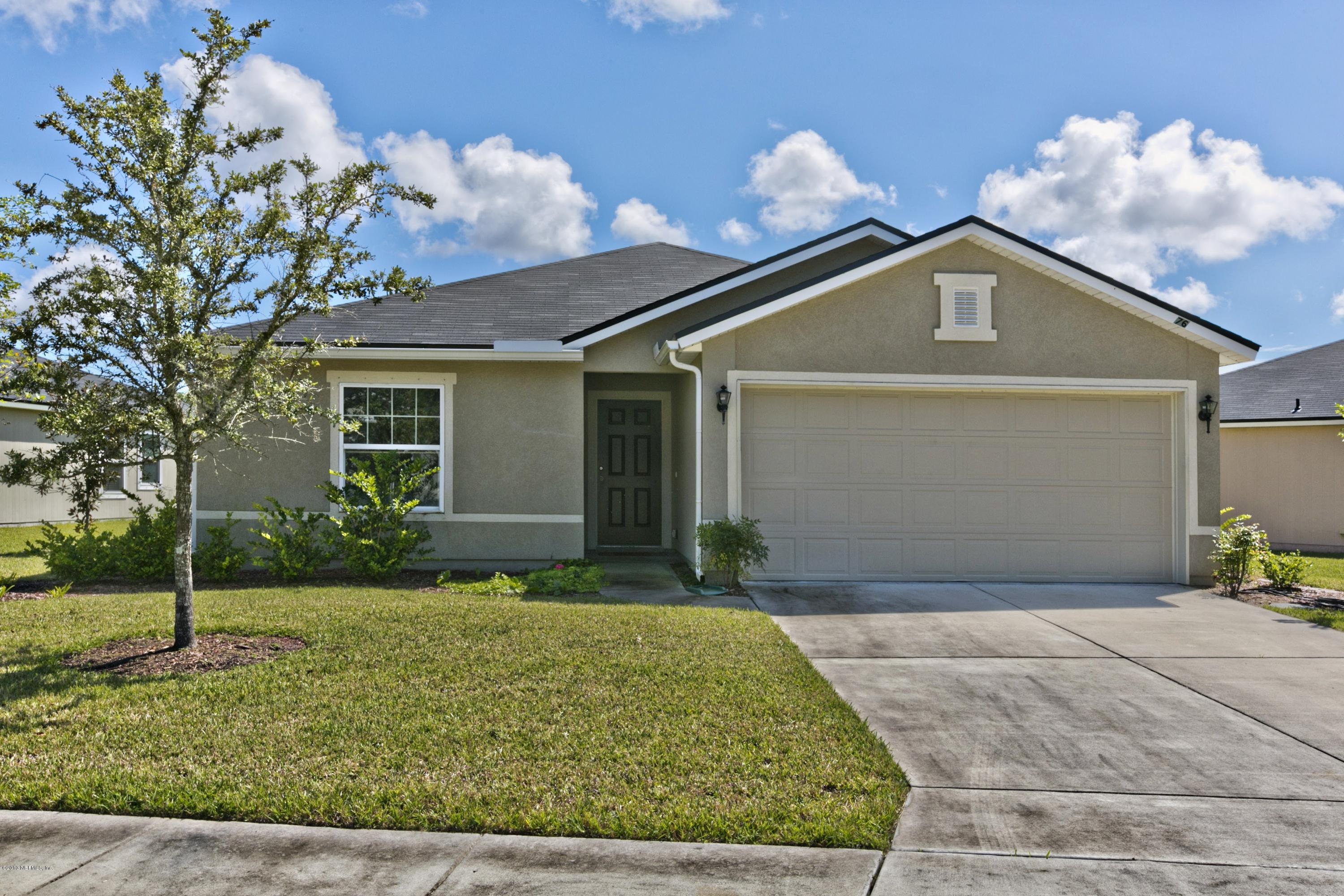 76 North Twin Maple Road St. Augustine, FL 32084 - Photo 1 of 21 a front view of a house with garden