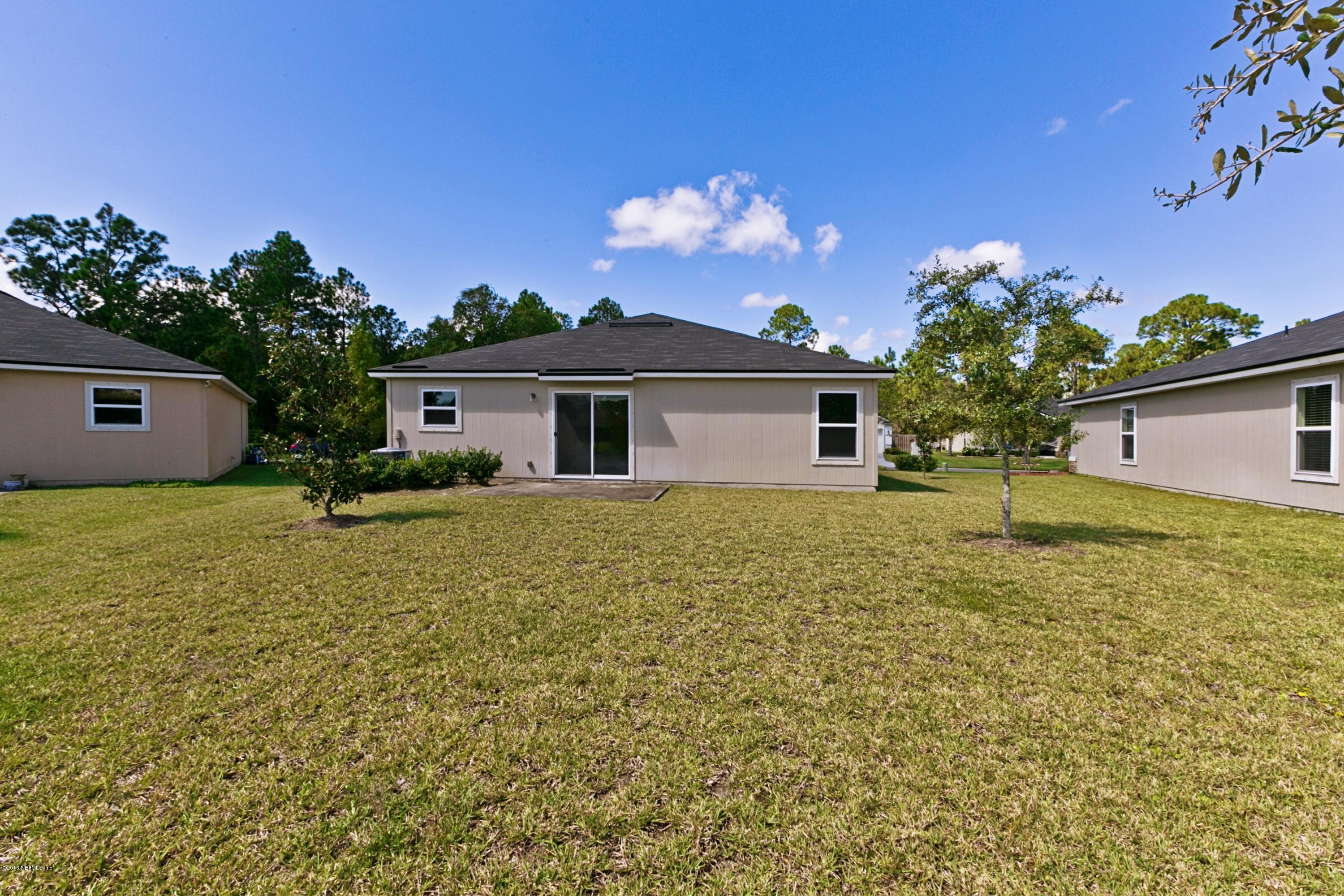 76 North Twin Maple Road St. Augustine, FL 32084 - Photo 17 of 21 a house view with a garden space