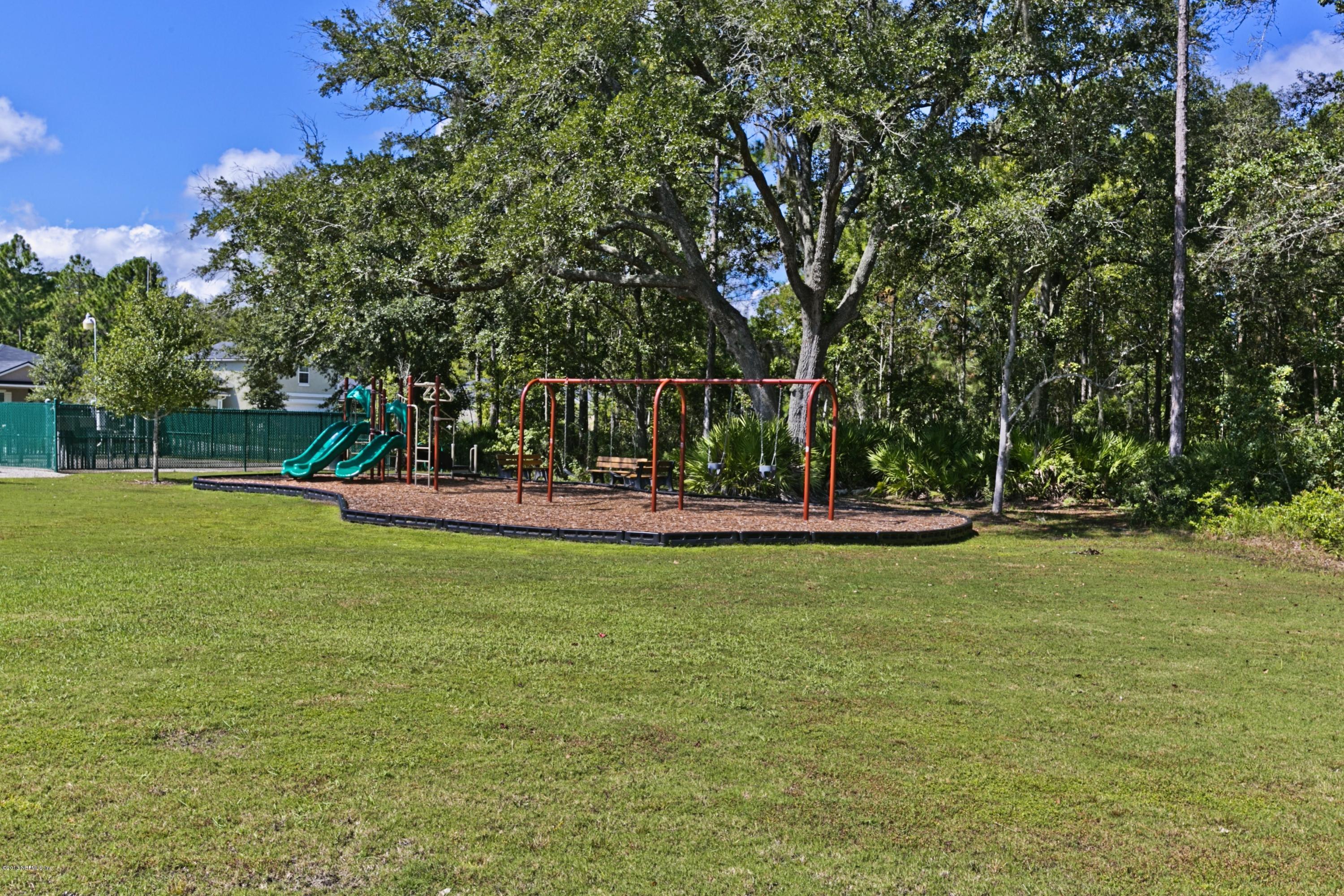 76 North Twin Maple Road St. Augustine, FL 32084 - Photo 20 of 21 a view of a park with large trees