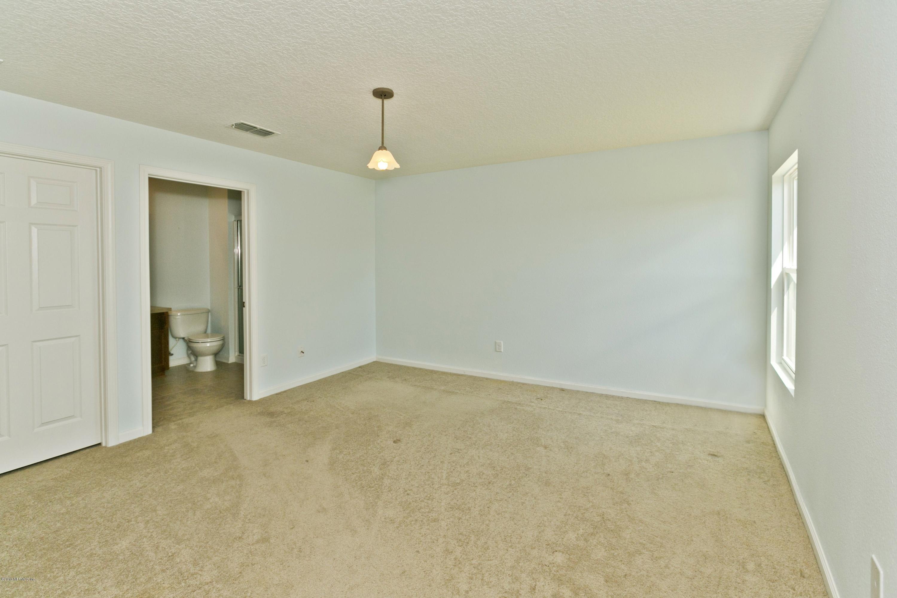 76 North Twin Maple Road St. Augustine, FL 32084 - Photo 8 of 21 an empty room with a natural light