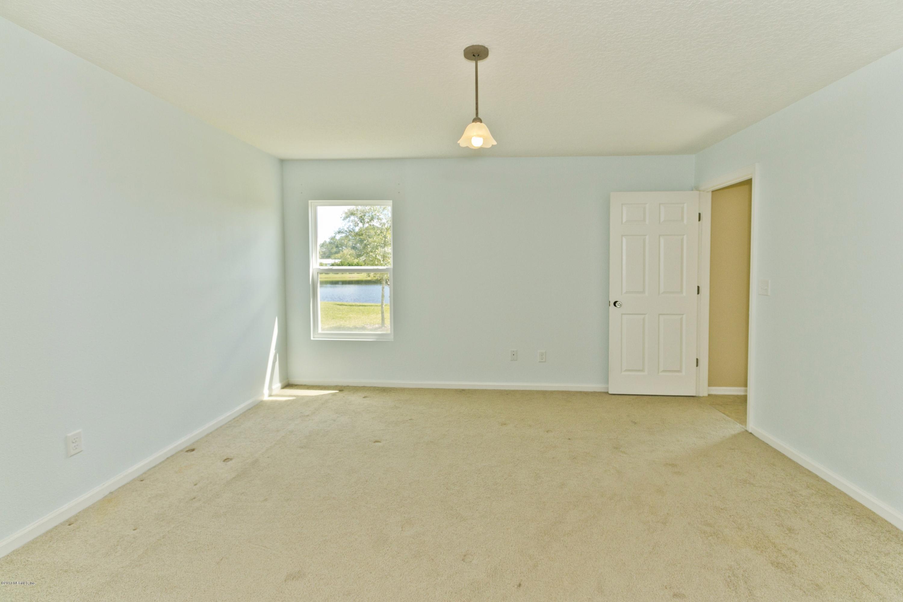 76 North Twin Maple Road St. Augustine, FL 32084 - Photo 9 of 21 a view of an empty room with a window