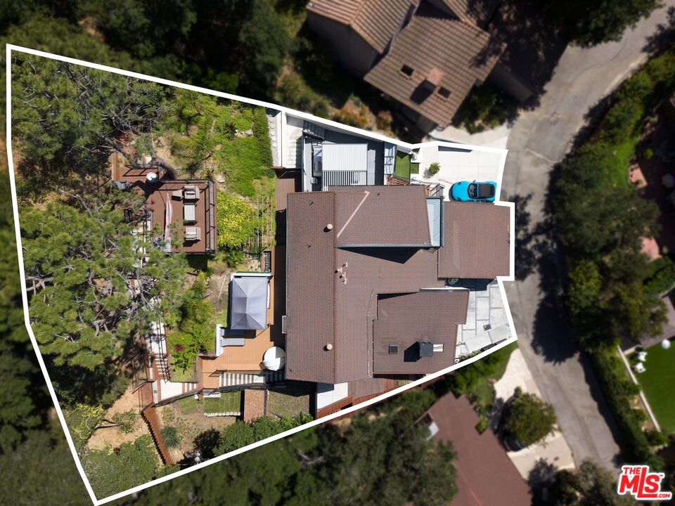4118 Oak Hollow Road Calabasas, CA 91302 - Photo 53 of 55 aerial view of a house with large trees and plants