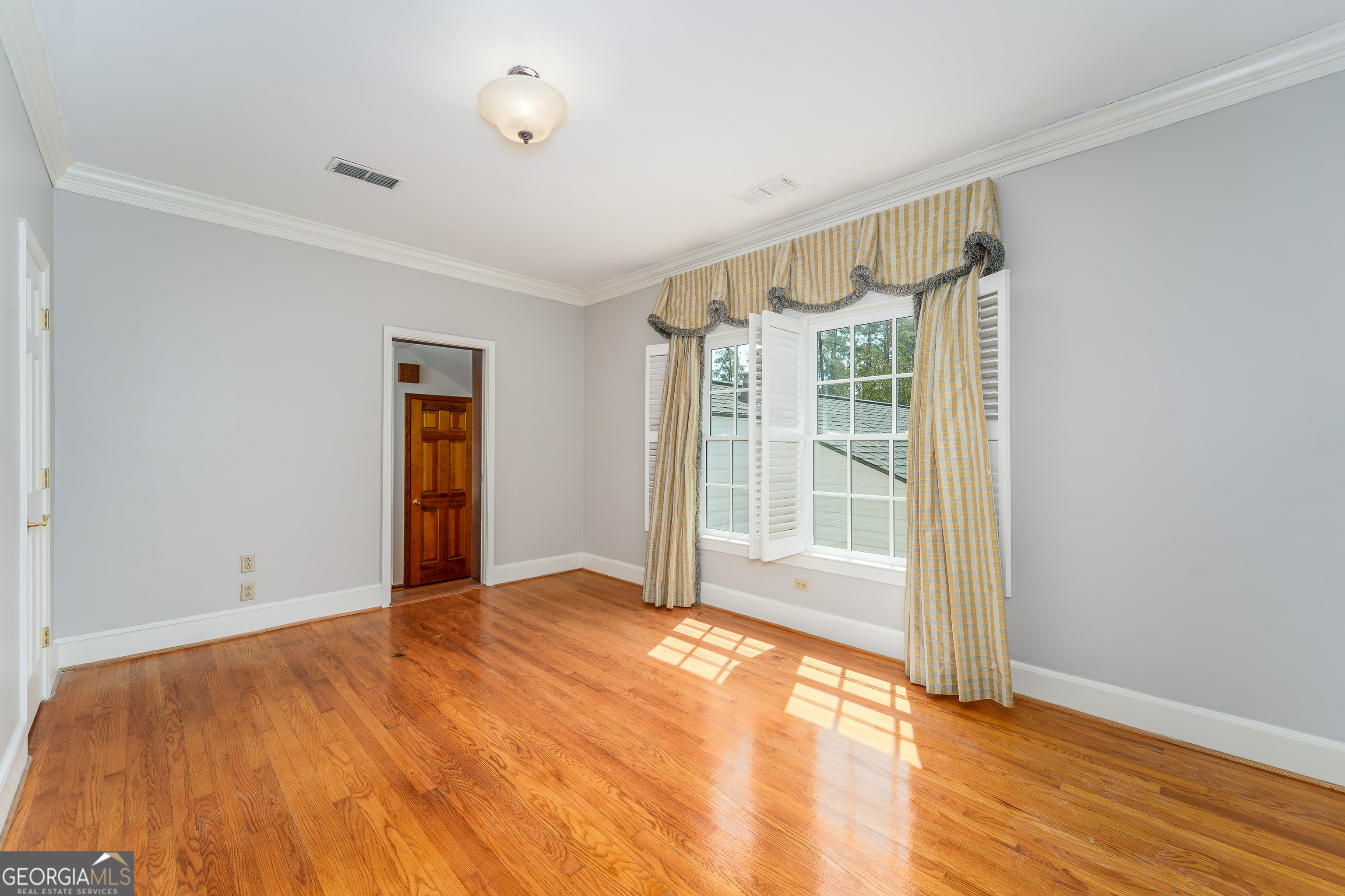1602 Ward St Extension West Douglas, GA 31533 - Photo 46 of 70 a view of an empty room with wooden floor and a window