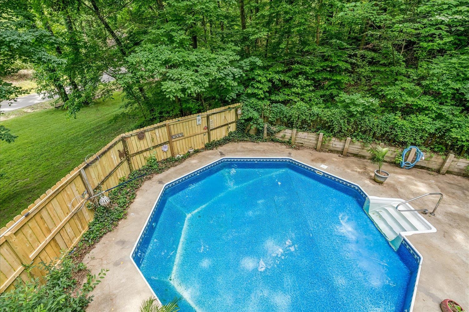 29 Claire Cove Ripley, TN 38063 - Photo 36 of 37 View from second story deck overlooking the pool and backyard.