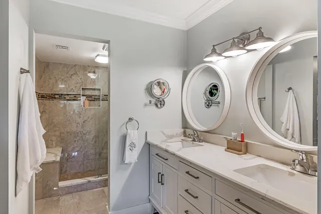 an aerial view of multiple house with a yard and lake view