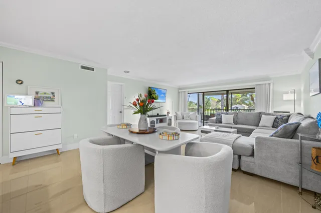 a living room with furniture and a table