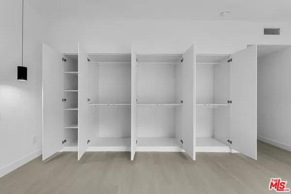 a bathroom with a double vanity sink mirror and shower