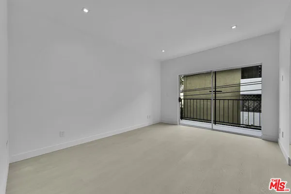 a view of room with hardwood floor