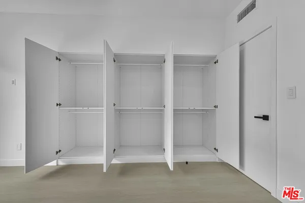 a large building with a bench in front of it