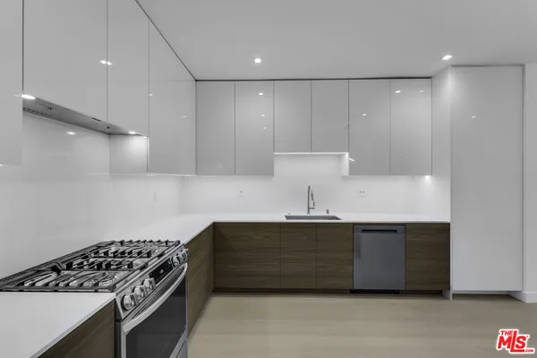 a kitchen with a sink and a stove