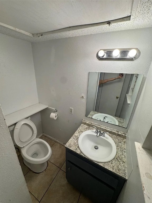 2904 Sweeney Lane, Unit D Austin, TX 78723 - Photo 3 of 6 a bathroom with a granite countertop toilet sink and mirror