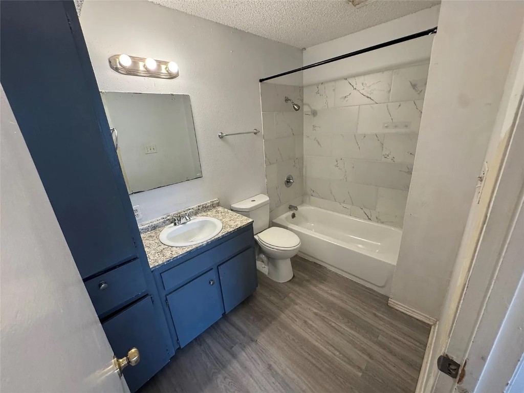 2904 Sweeney Lane, Unit D Austin, TX 78723 - Photo 6 of 6 a bathroom with a granite countertop sink toilet and shower
